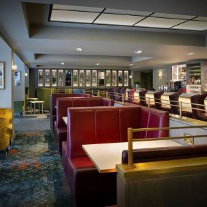 Hotel bar with comfortable seating, perfect for co-working at Leonardo Royal Hotel London City.