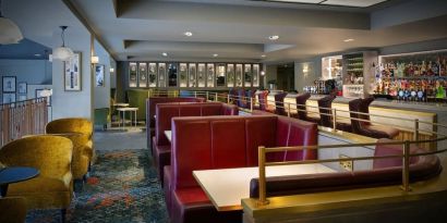 Hotel bar with comfortable seating, perfect for co-working at Leonardo Royal Hotel London City.