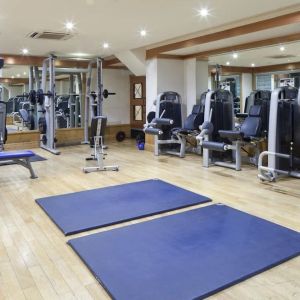 Fully equipped fitness center at Leonardo Royal Hotel London City.