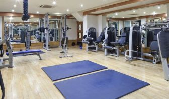 Fully equipped fitness center at Leonardo Royal Hotel London City.