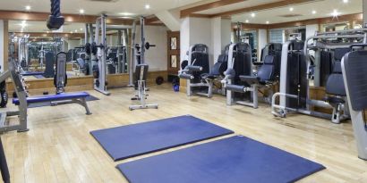 Fully equipped fitness center at Leonardo Royal Hotel London City.