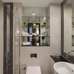 Guest bathroom with shower and free toiletries at Leonardo Royal St Paul's Hotel.