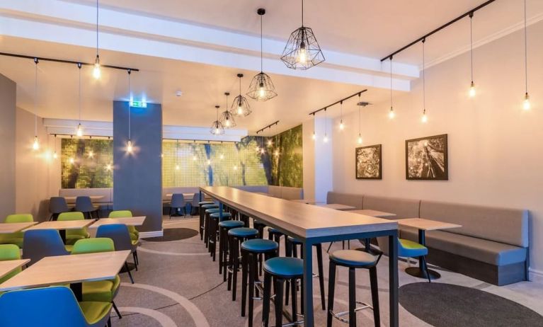 Dining area with comfortable seating, perfect for co-working at Thistle Express London, Luton.