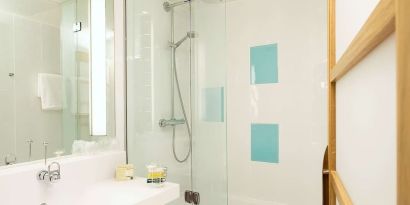 Guest bathroom with shower at Novotel Manchester West.