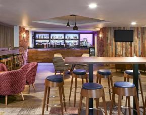 Hotel bar with lounge seating at Novotel Manchester West.