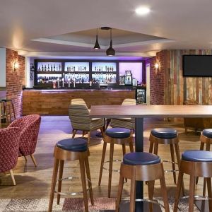 Hotel bar with lounge seating at Novotel Manchester West.