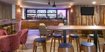 Hotel bar with lounge seating at Novotel Manchester West.