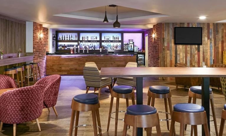 Hotel bar with lounge seating at Novotel Manchester West.