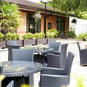 Hotel terrace with comfortable seating at Novotel Manchester West.