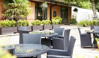 Hotel terrace with comfortable seating at Novotel Manchester West.