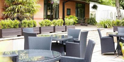 Hotel terrace with comfortable seating at Novotel Manchester West.