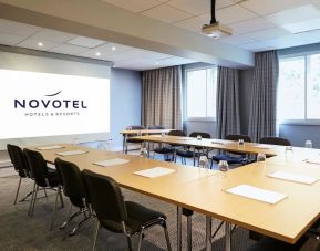 Professional meeting room with U shaped table at Novotel Manchester West.