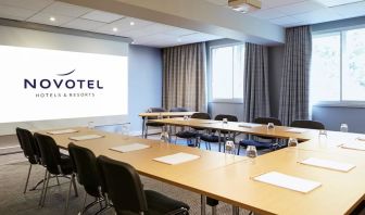 Professional meeting room with U shaped table at Novotel Manchester West.