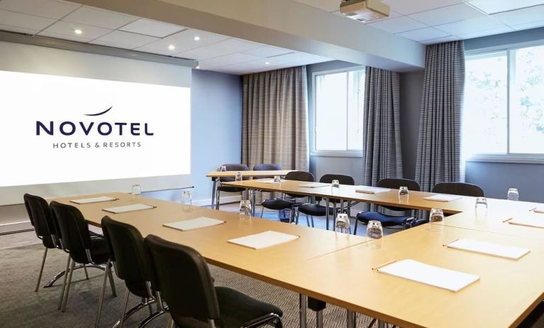 Professional meeting room with U shaped table at Novotel Manchester West.