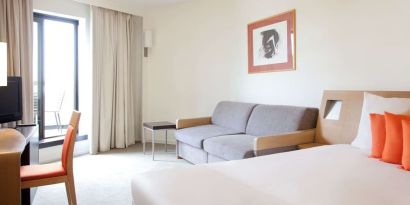 Day use superior room with work desk and living area at Novotel Manchester West.