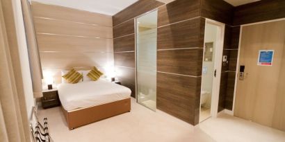 Bright and spacious day use room with private bathroom and workspace at The Wesley Euston Hotel.