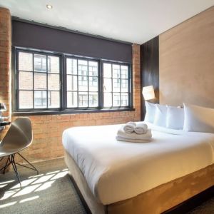 Day use room with large window, work desk and coffee maker at Bloc Hotel Birmingham.