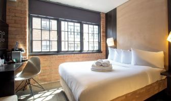 Day use room with large window, work desk and coffee maker at Bloc Hotel Birmingham.