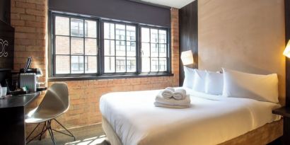 Day use room with large window, work desk and coffee maker at Bloc Hotel Birmingham.