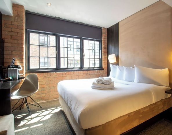 Day use room with large window, work desk and coffee maker at Bloc Hotel Birmingham.