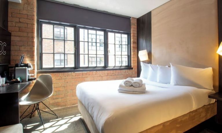 Day use room with large window, work desk and coffee maker at Bloc Hotel Birmingham.