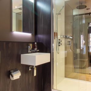 Guest bathroom with shower and free toiletries at Bloc Hotel Birmingham.