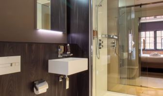 Guest bathroom with shower and free toiletries at Bloc Hotel Birmingham.