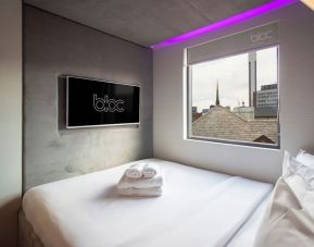 Day use room with TV screen and city view at Bloc Hotel Birmingham.