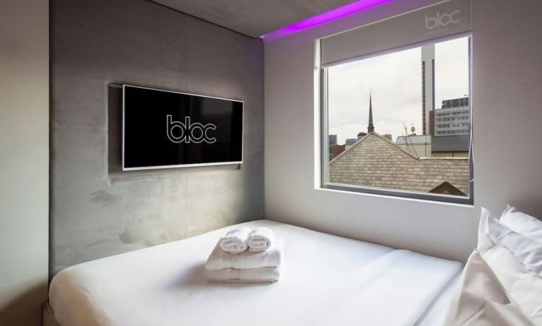 Day use room with TV screen and city view at Bloc Hotel Birmingham.