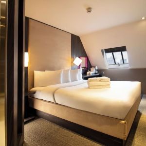 Day use room with king bed and private bathroom with shower at Bloc Hotel Birmingham.