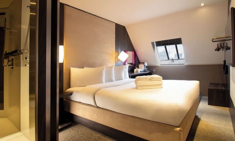 Day use room with king bed and private bathroom with shower at Bloc Hotel Birmingham.