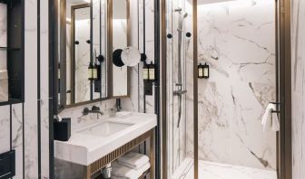 Guest bathroom with shower and free toiletries at Page8, Page Hotels.