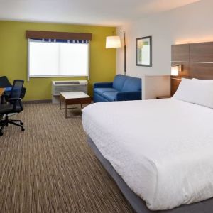 Day use room with work desk and sofa at Holiday Inn Express & Suites Ottumwa.