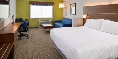 Day use room with work desk and sofa at Holiday Inn Express & Suites Ottumwa.