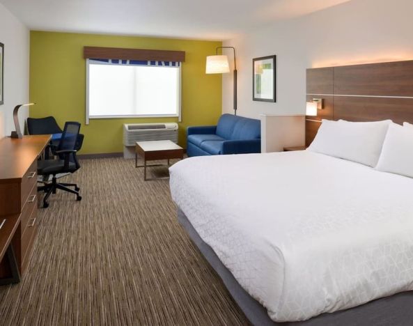 Day use room with work desk and sofa at Holiday Inn Express & Suites Ottumwa.