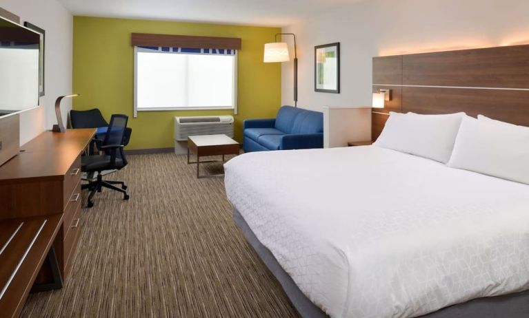 Day use room with work desk and sofa at Holiday Inn Express & Suites Ottumwa.