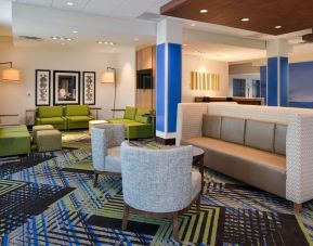 Lobby and coworking lounge at Holiday Inn Express & Suites Ottumwa.