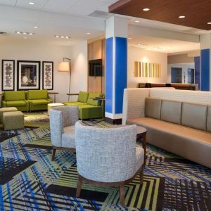 Lobby and coworking lounge at Holiday Inn Express & Suites Ottumwa.