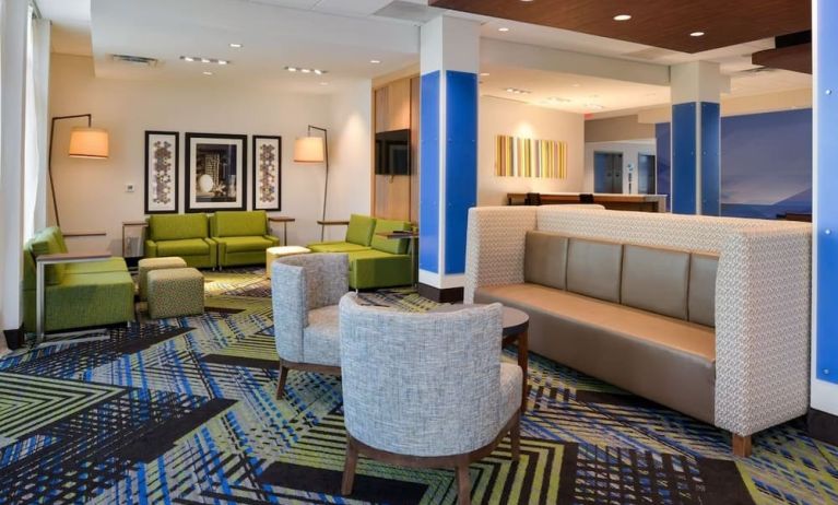 Lobby and coworking lounge at Holiday Inn Express & Suites Ottumwa.