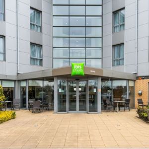 Hotel entrance with exterior lounge seating at Ibis Styles Barnsley.