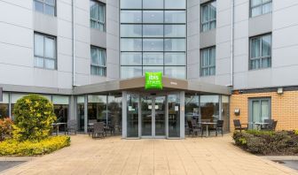 Hotel entrance with exterior lounge seating at Ibis Styles Barnsley.