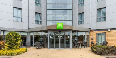 Hotel entrance with exterior lounge seating at Ibis Styles Barnsley.