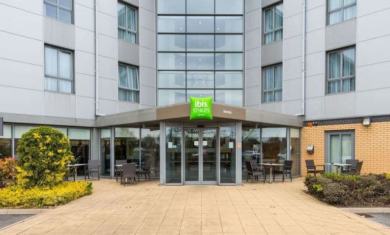 Hotel entrance with exterior lounge seating at Ibis Styles Barnsley.