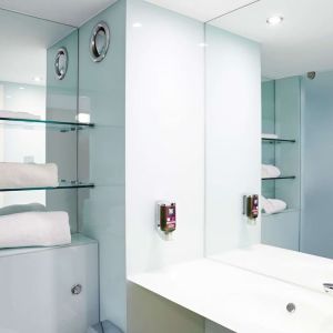 Guest bathroom with shower and free toiletries at Ibis Styles Barnsley.