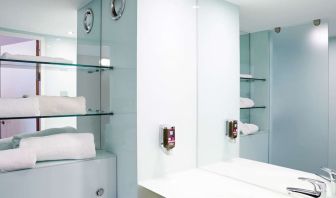 Guest bathroom with shower and free toiletries at Ibis Styles Barnsley.