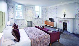 Day use room with king bed and sofa at Barnett Hill Hotel.