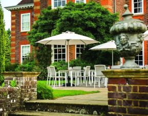 Outdoor lounge with beautiful view of the garden at Barnett Hill Hotel.