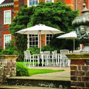 Outdoor lounge with beautiful view of the garden at Barnett Hill Hotel.