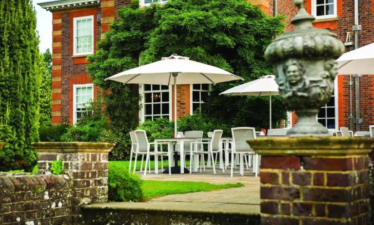 Outdoor lounge with beautiful view of the garden at Barnett Hill Hotel.