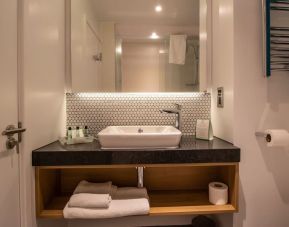 Guest bathroom with shower and free toiletries at Holiday Inn Leicester-Wigston.